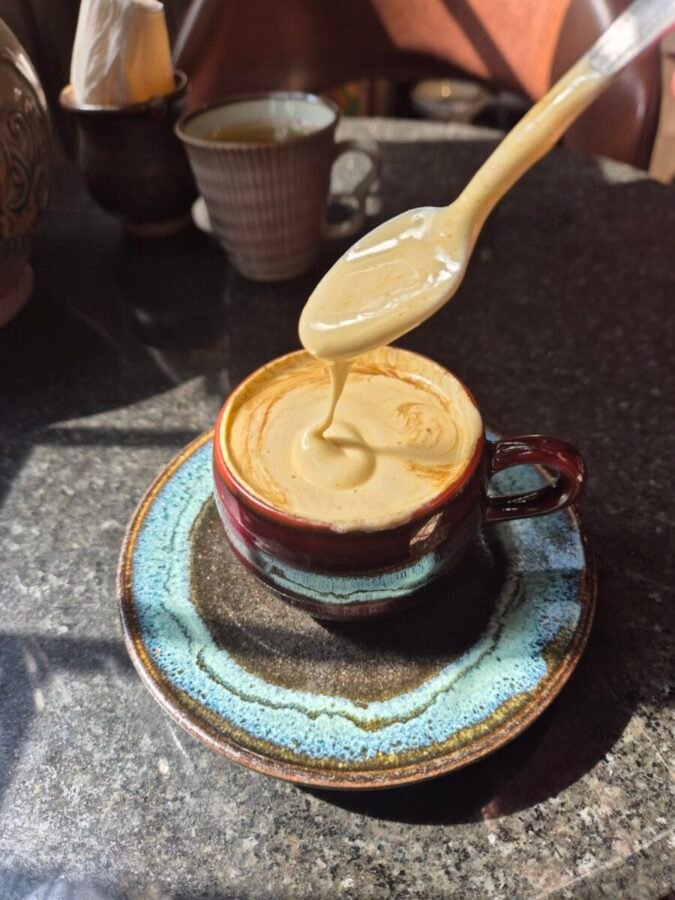 Egg coffee being poured in a café in Hanoi
