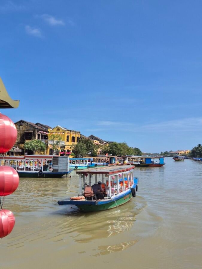 Hoi An Thu Bon river River scene in Hoi An with traditional boats and historic buildings