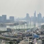 Ho Chi Minh City skyline with river and surrounding buildings viewed from above