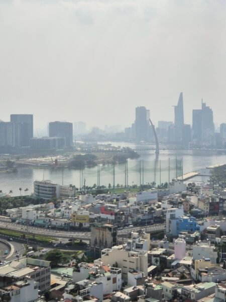 Ho Chi Minh City skyline with river and surrounding buildings viewed from above