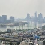 Ho Chi Minh City skyline with river and surrounding buildings viewed from above