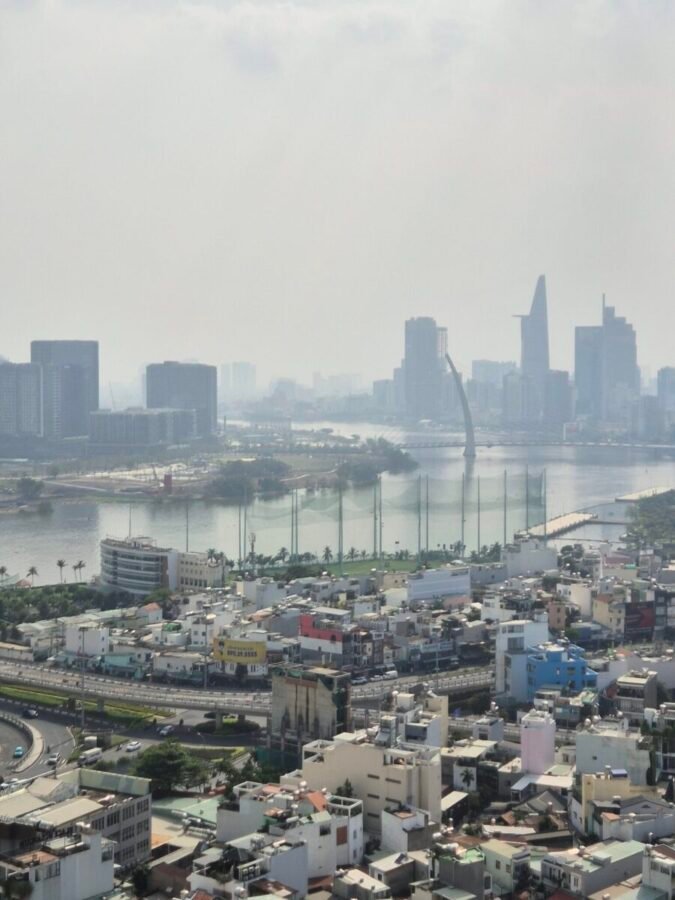 Ho Chi Minh City skyline with river and surrounding buildings viewed from above
