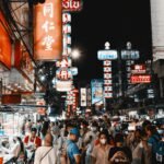 Busy tourist nightlife area in Thailand, contrasting with everyday local rhythms