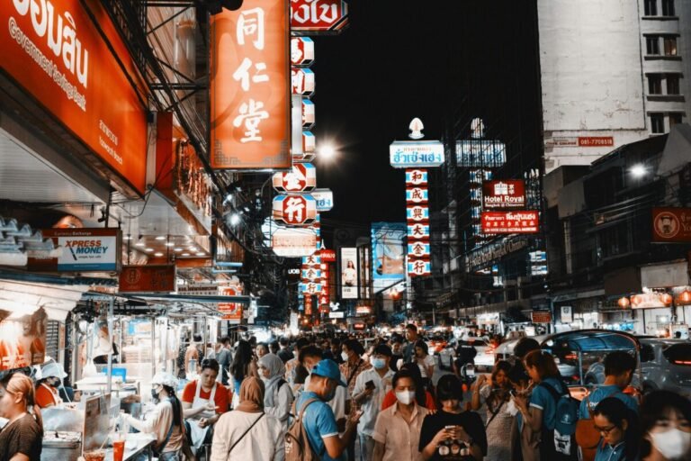 Busy tourist nightlife area in Thailand, contrasting with everyday local rhythms
