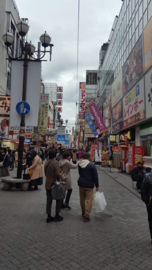 Osaka Dohtonbori Street scene in central Osaka with pedestrians and shops
