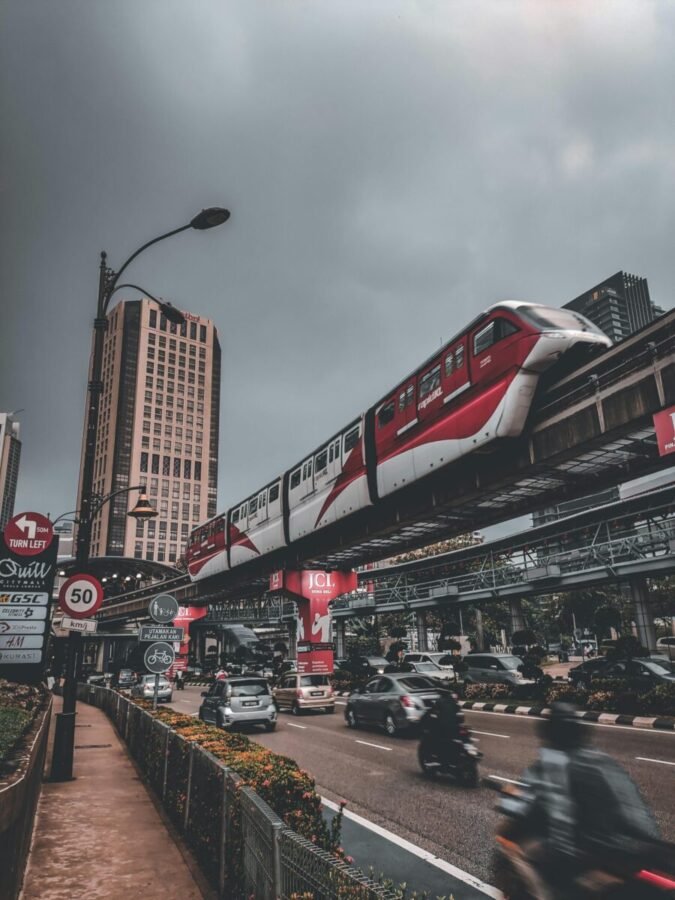 kuala-lumpur-monorail-bukit-bintang Kuala Lumpur monorail passing above traffic near Bukit Bintang shopping district