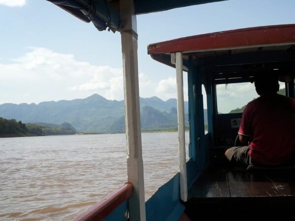 View of the Mekong River and mountains from a small boat in Luang Prabang