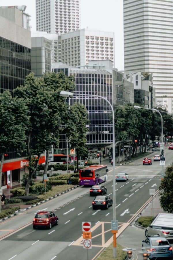 singapore-city-street-bus-traffic Singapore city street with public buses and organised traffic flow in central business district
