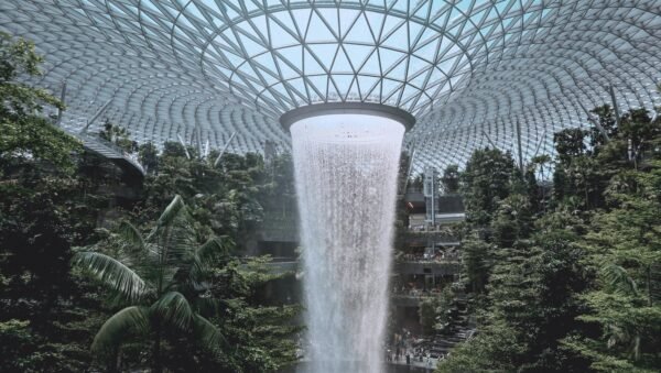 HSBC Rain Vortex waterfall inside Jewel Changi Airport Singapore surrounded by indoor forest