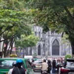 Street scene with traffic and motorbikes in front of St Joseph’s Cathedral in Hanoi, Vietnam