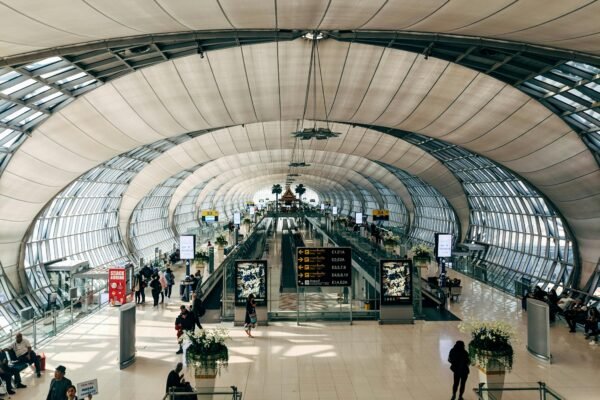 Interior of Suvarnabhumi Airport arrivals hall in Bangkok with curved ceiling and terminal structure